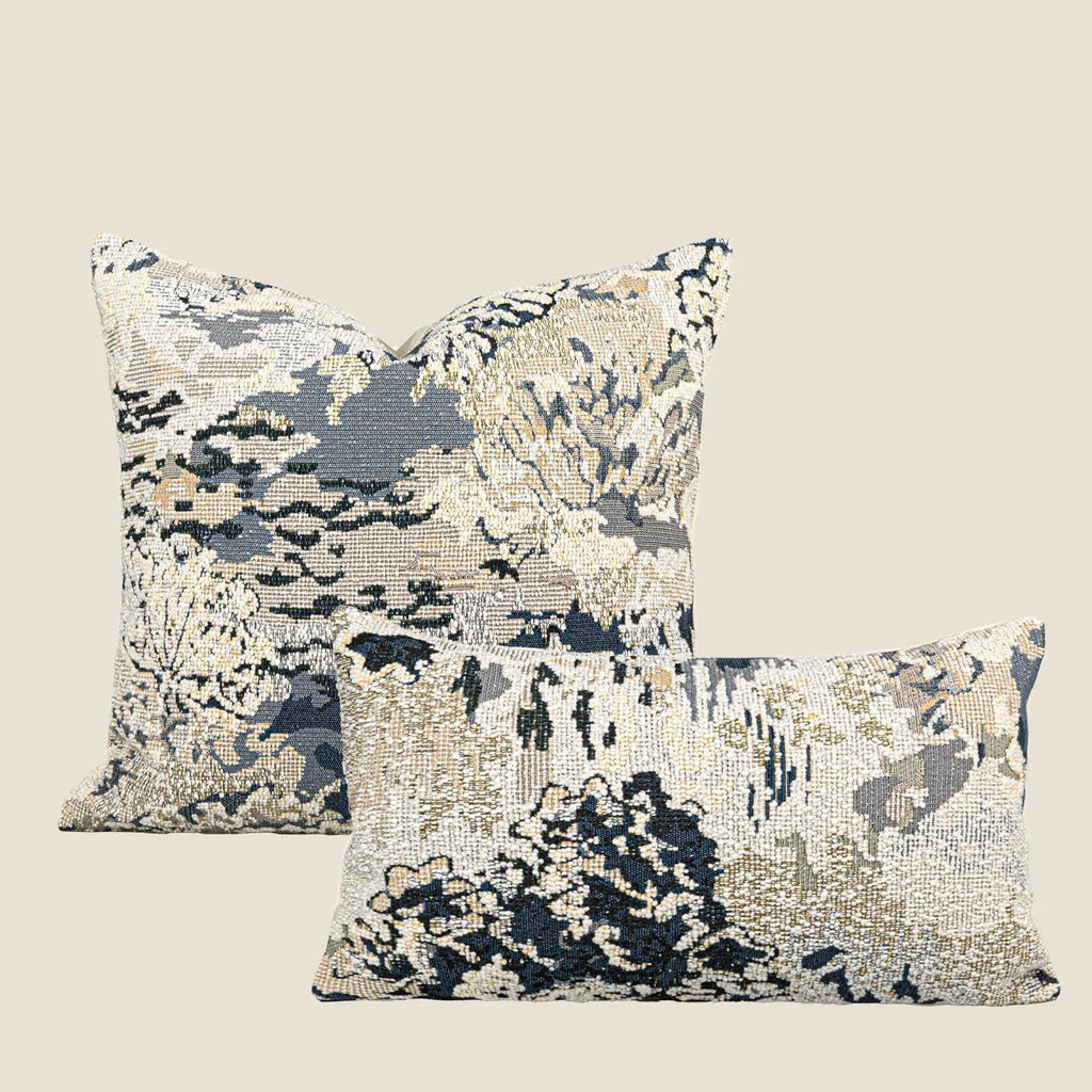Antique blue decorative pillow with abstract flower pattern, shown in square and waist pillow sizes.