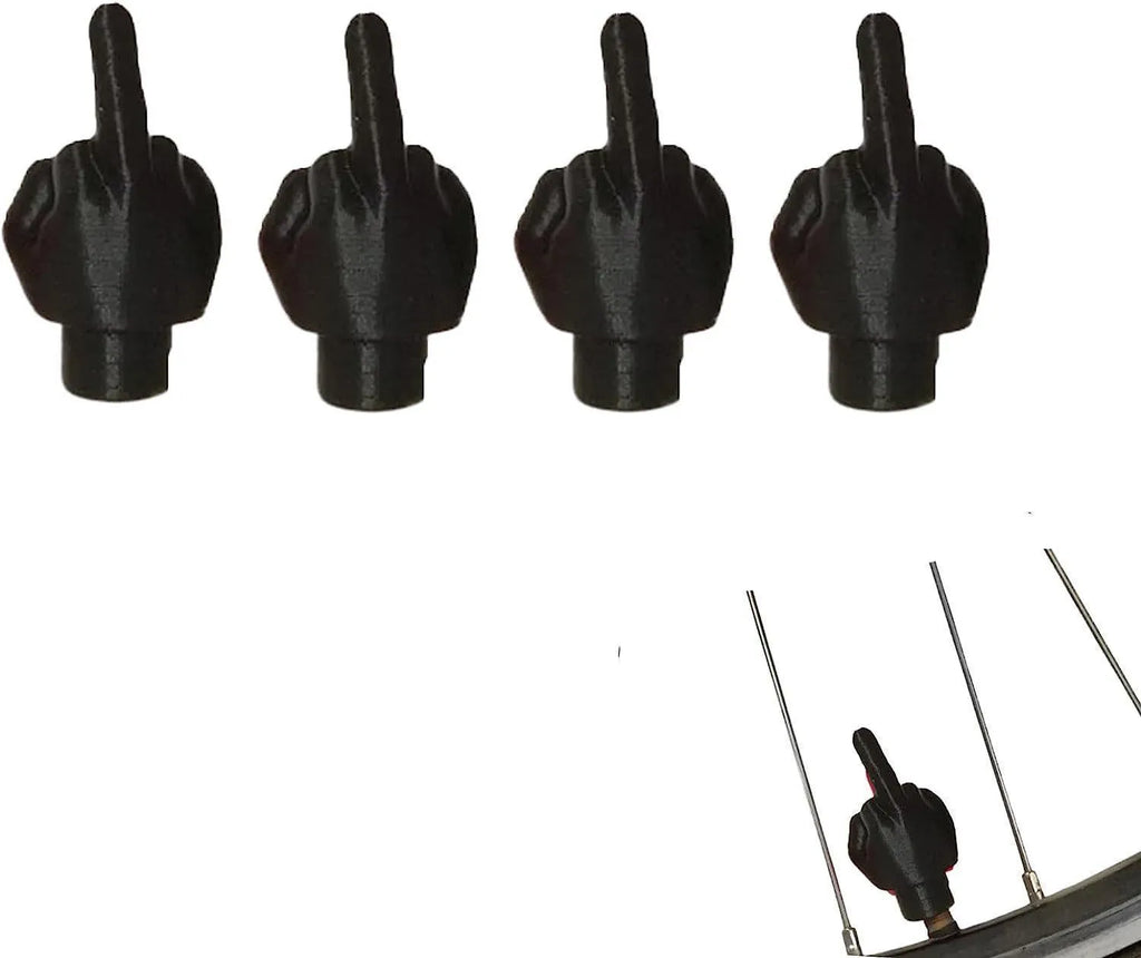 Four latex tyre valve dust caps in skin colour and black colours