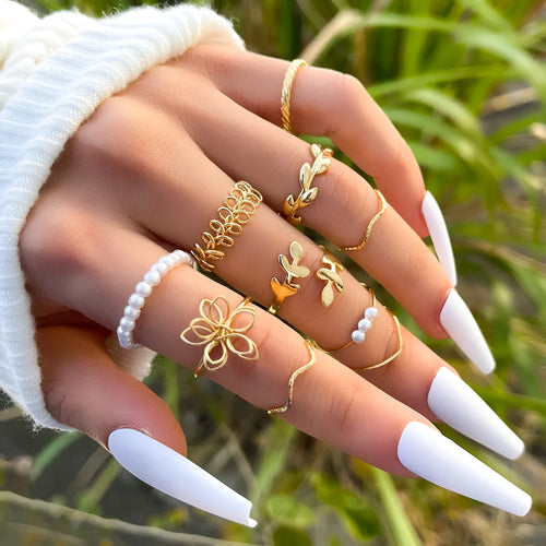 Gold openwork flower ring with alloy construction and electroplated glossy finish