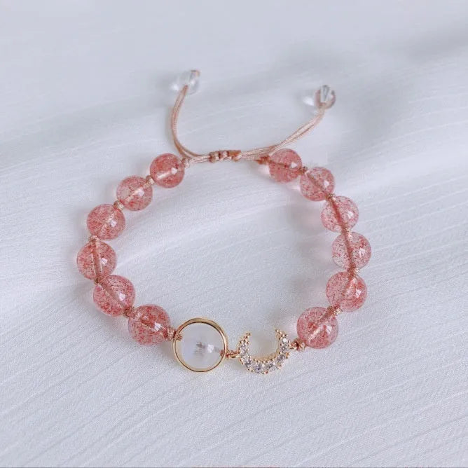 Handcrafted strawberry quartz crystal bracelet with Hetian jade peach blossom charms