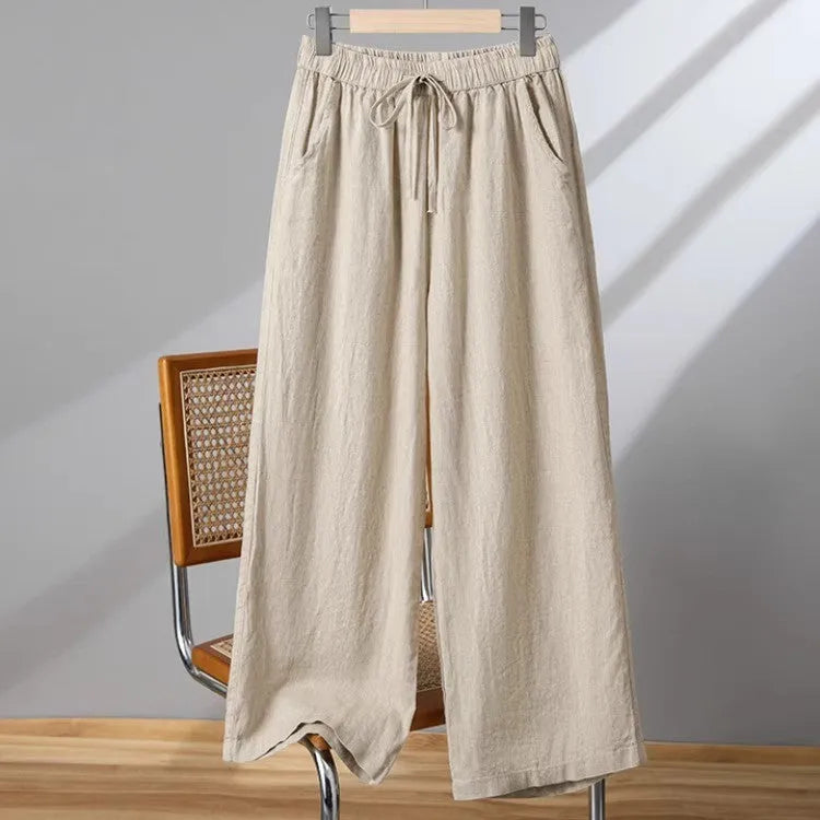 Women's straight-leg casual trousers with elastic waist and lace-up drawstring detail in polyester fabric