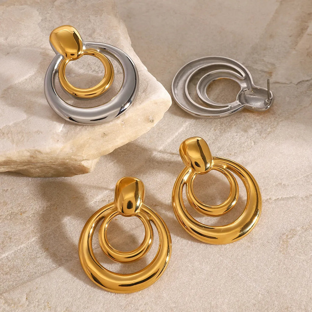 Golden round double layer hollow stud earrings with geometric design and 18K gold electroplating