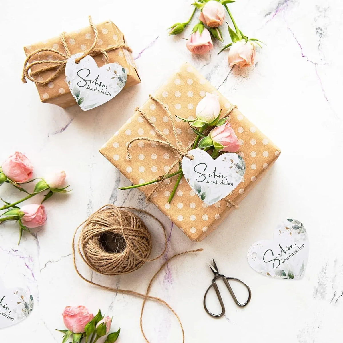 Set of fifty red and white heart-shaped paper gift tags with a half-handmade finish