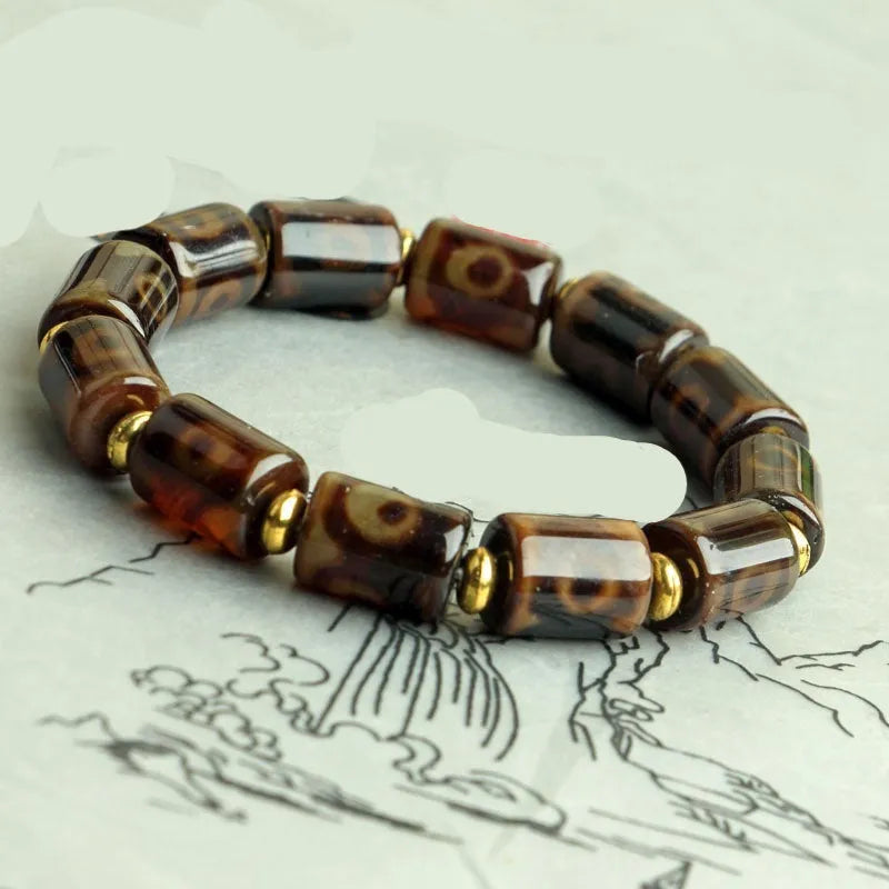 Distressed agate Tibet beads bracelet with three eye dzi design and polished stone beads