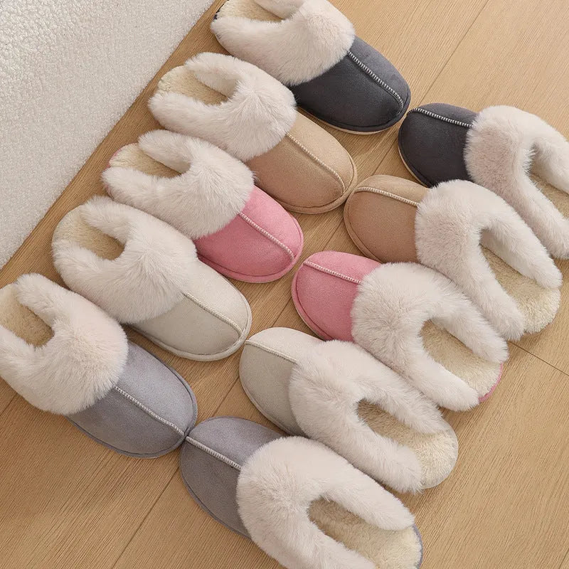 Women's plush winter slippers in grey with a round toe, flat heel, and non-slip PVC sole.