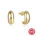 A single pair of glossy C-shaped sterling silver stud earrings on a white background.