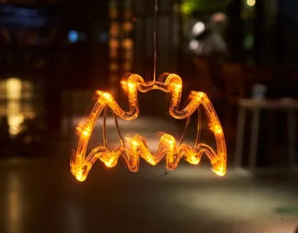 Halloween LED hanging lights with spider, pumpkin and ghost designs featuring suction cups for window mounting