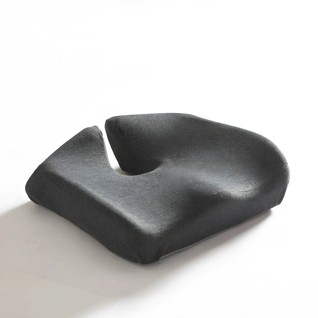 Memory foam office chair cushion with removable mesh cover in grey, shown on a desk chair.