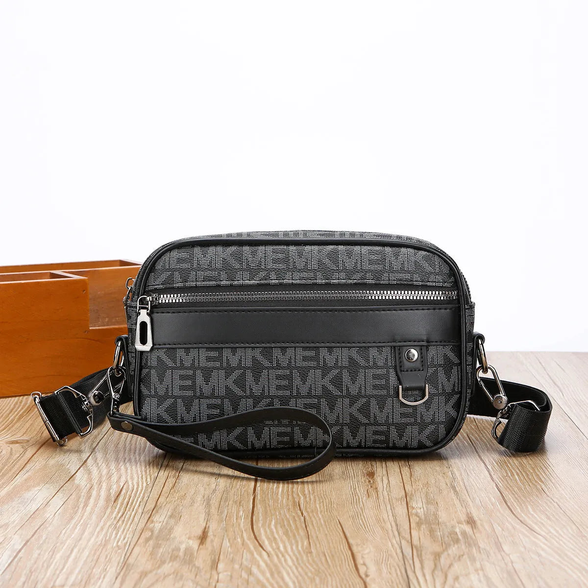 Men's black PU leather messenger bag with a geometric pattern, shown worn crossbody.