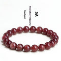 Natural strawberry quartz bracelet showing cherry red colour with starlight effects on geometric beads