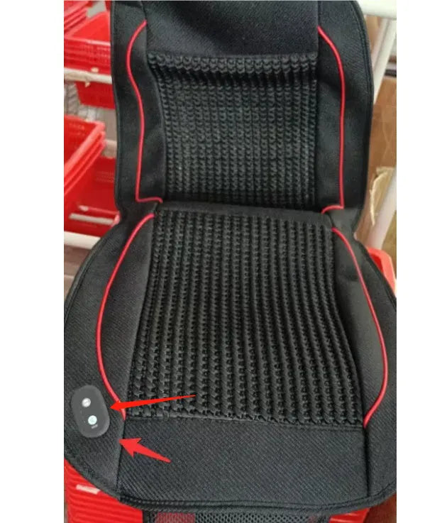Black minimalist car ventilation seat cushion with power cord on a car seat.