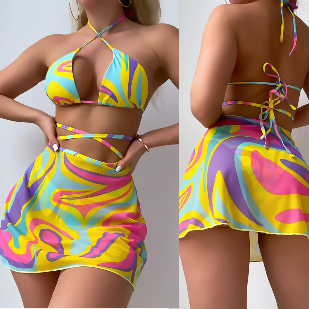 Yellow striped halter neck swimsuit set for women, showing top, skirt, and shorts with lace-up detail.