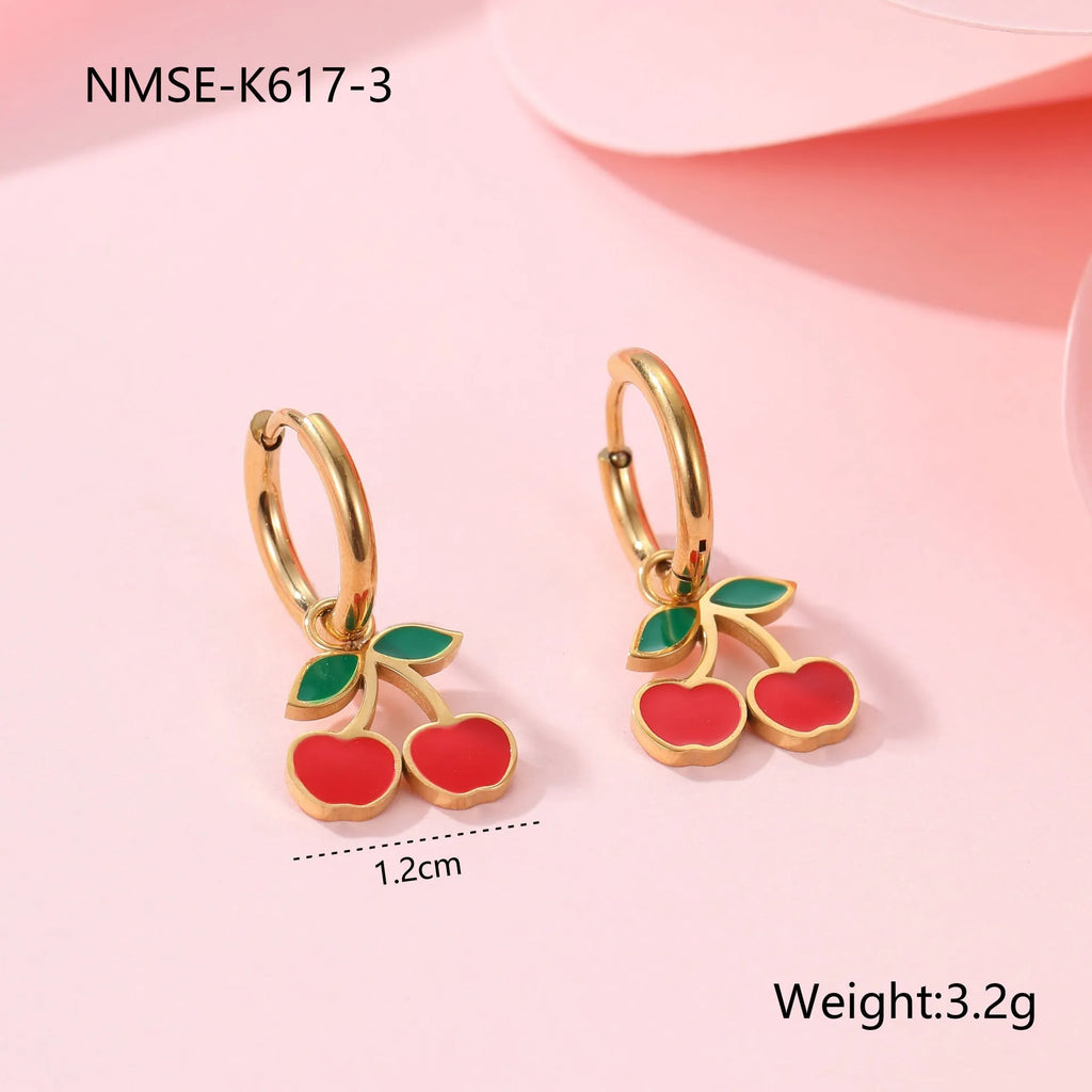 Four-piece cherry jewellery set showing necklace, bracelet, earrings, and ring with 18K electroplated finish