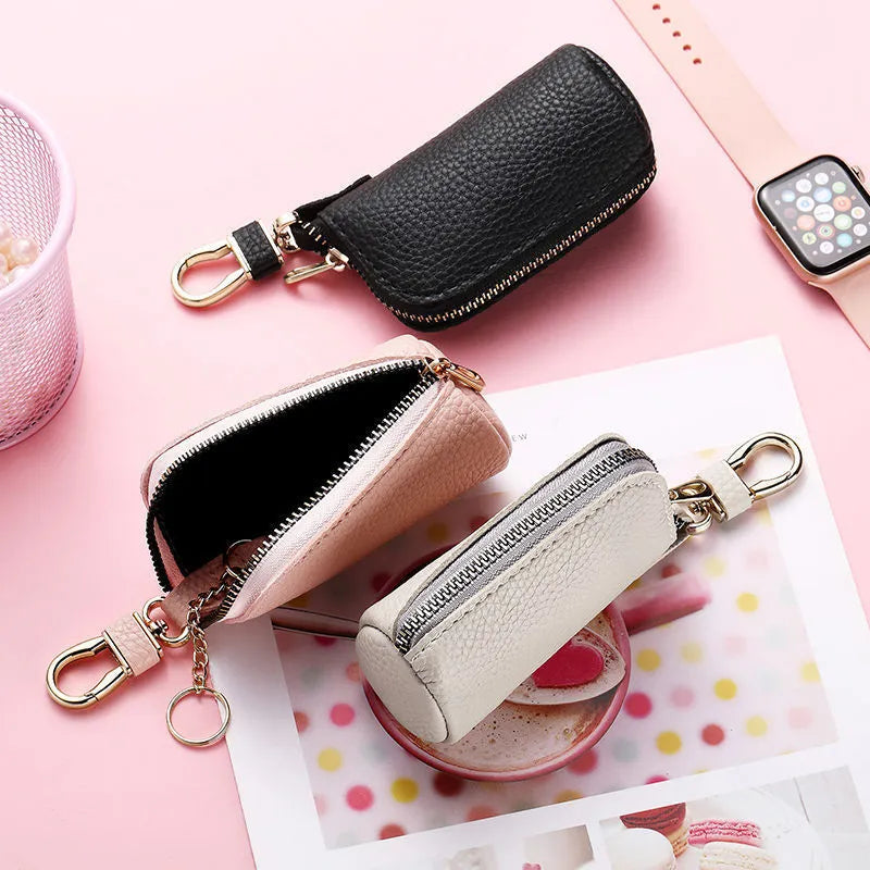 Minimalist waterproof PU leather key case with zipper closure in black, grey, and pink colours