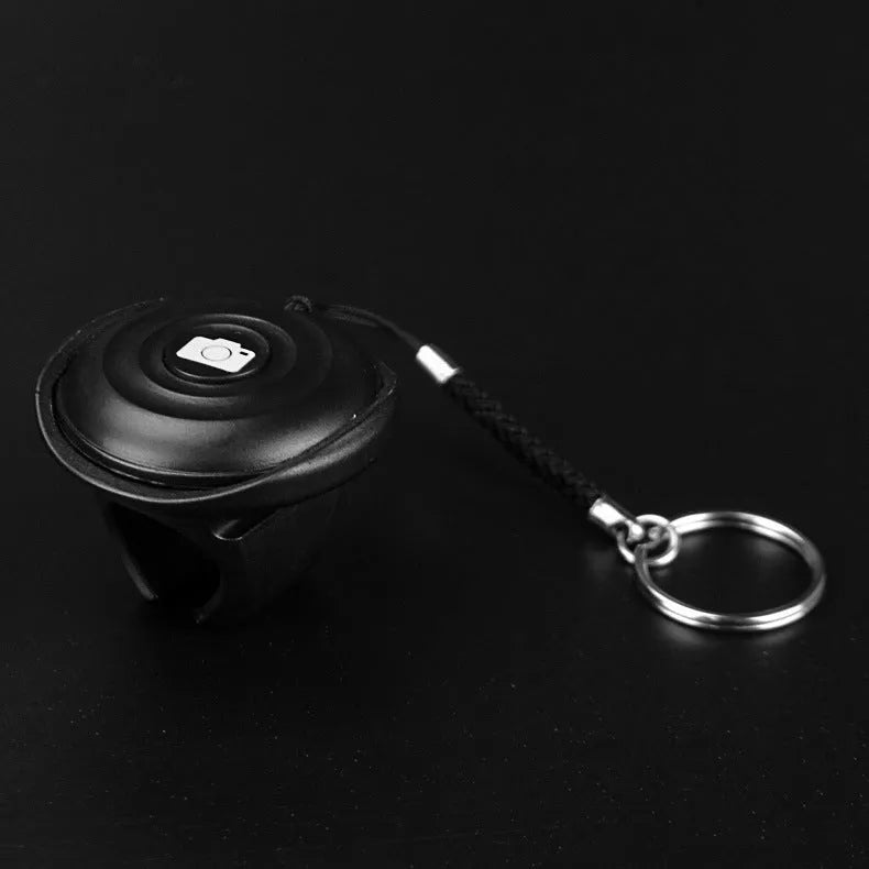 Black Bluetooth remote control for mobile phone photography with single shutter button