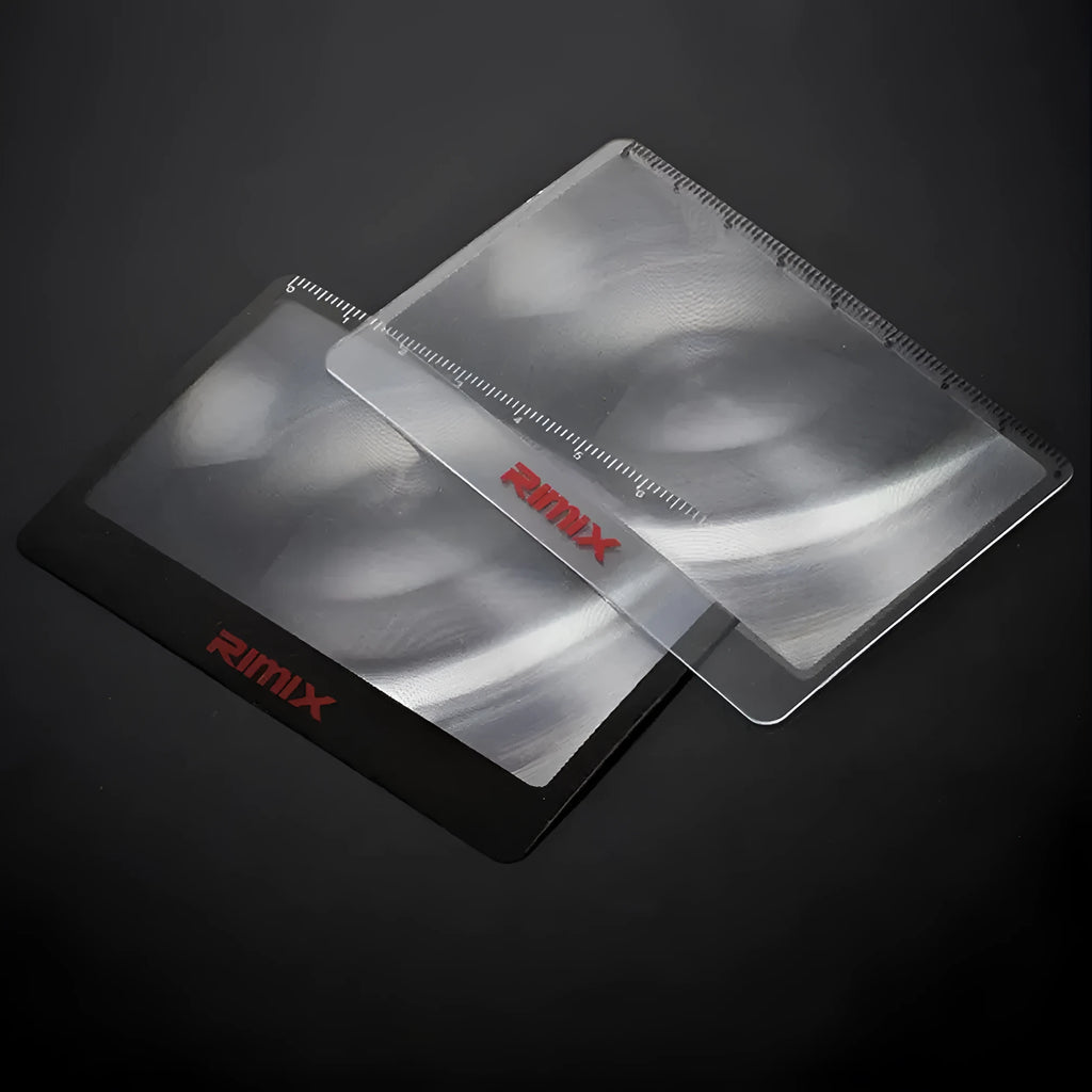 Black and white portable credit card sized plastic magnifier for reading