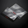 Black and white portable credit card sized plastic magnifier for reading