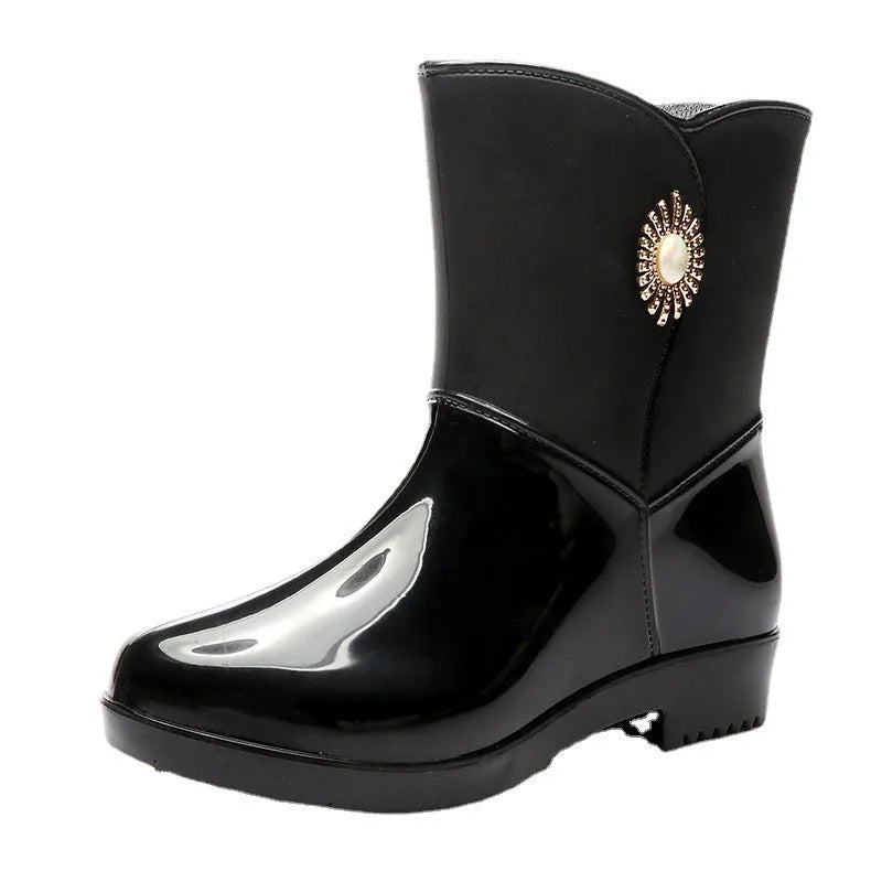 Women's mid-calf PVC rain boots in purple, black, or beige with a non-slip sole.