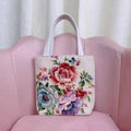 Double-sided gold wire embroidered handheld canvas tote bag in a choice of seven patterns and three sizes.