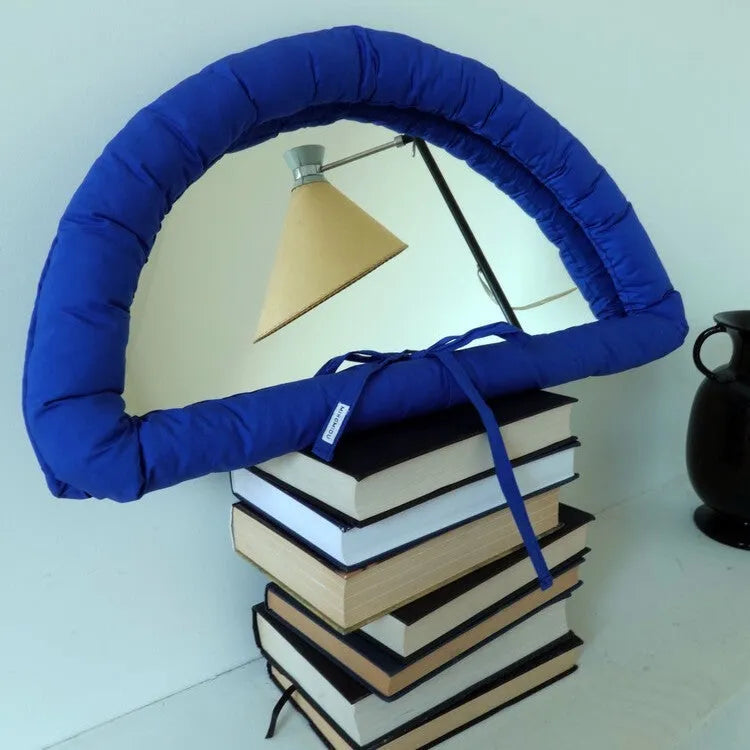 Hanging soft cotton-filled fabric mirror in solid colour for background use