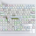 PBT sublimation keycap set showing cat and puppy character designs on mechanical keyboard keys