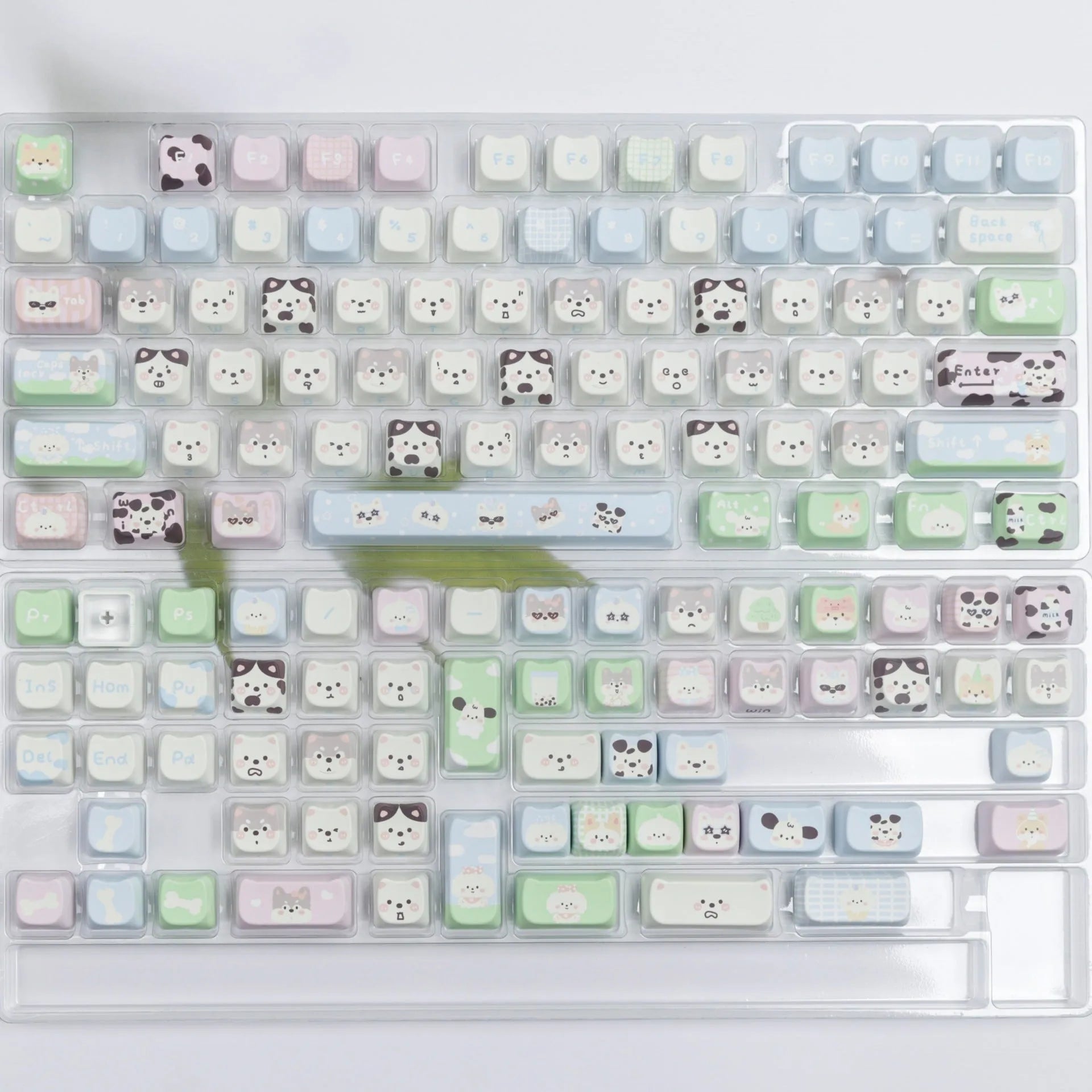 PBT sublimation keycap set showing cat and puppy character designs on mechanical keyboard keys