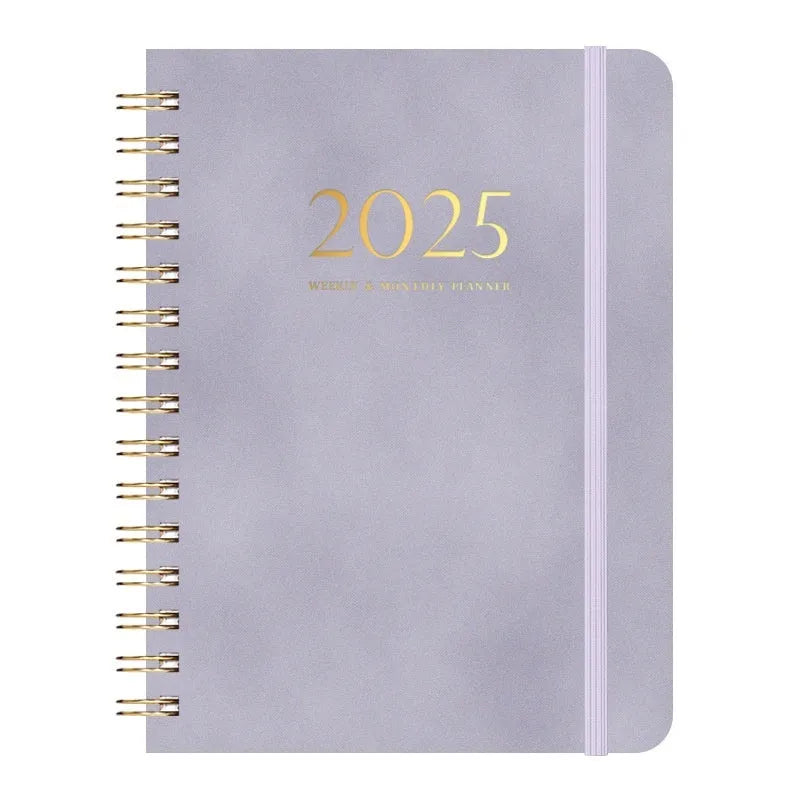 A5 leather notebook with metal coil binding in various colours including black, blue, and green.