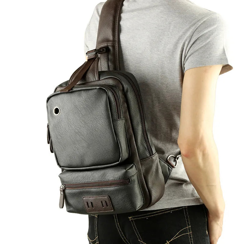 PU leather men's chest bag satchel in black, 21x13x34cm, with zip opening and ID pocket, fits 9.7 inch iPad