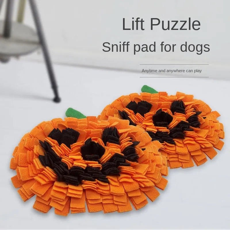 Orange pumpkin-shaped dog sniffing mat with a textured fur-like surface for slow feeding and enrichment.