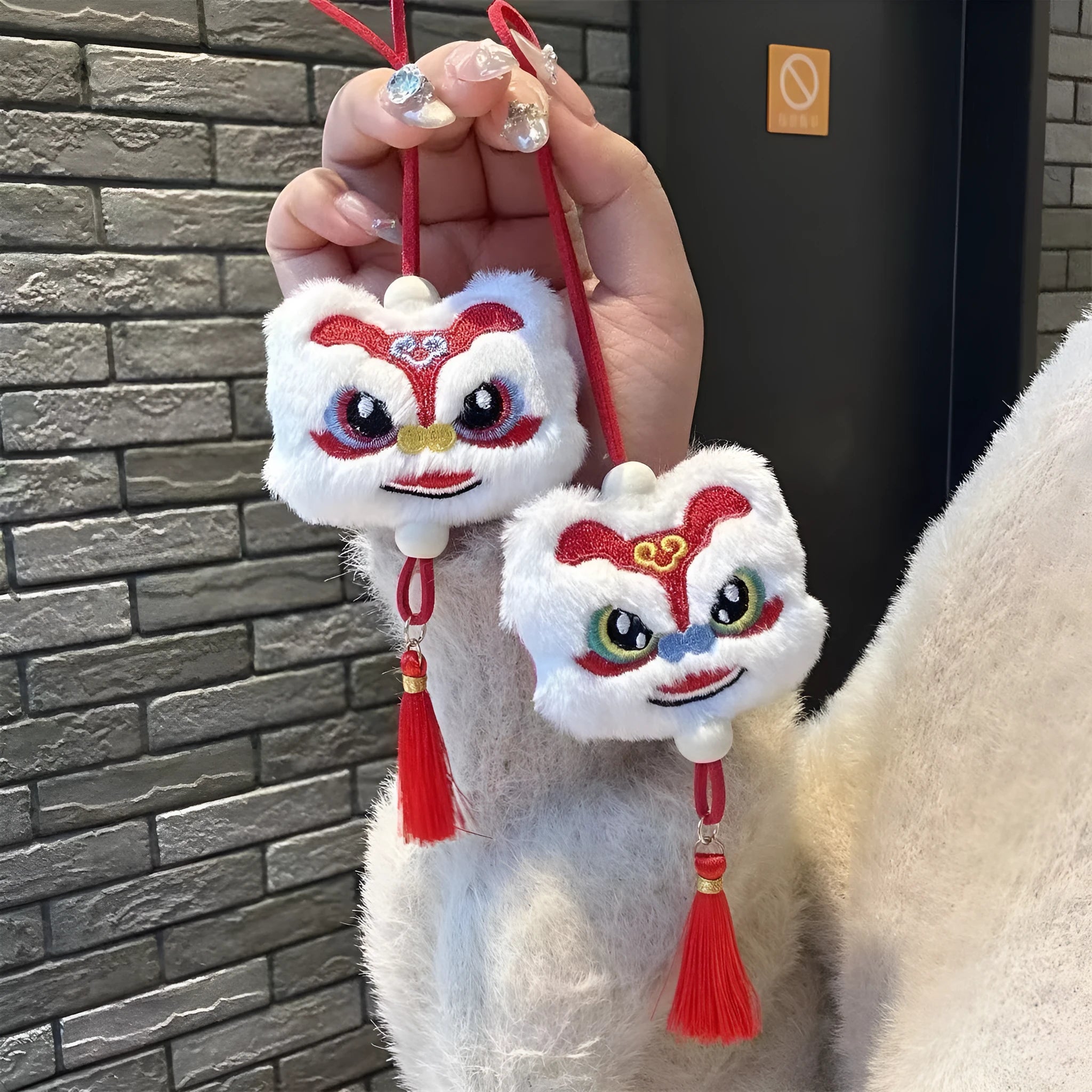 Chinese style plush lion keychain ornament with tassel and star stone accents in blue or yellow