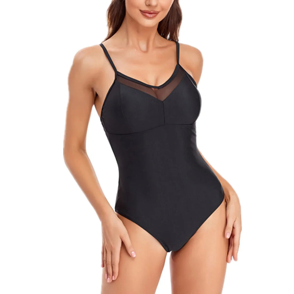A black one-piece backless swimsuit with a mesh panel detail on a mannequin.