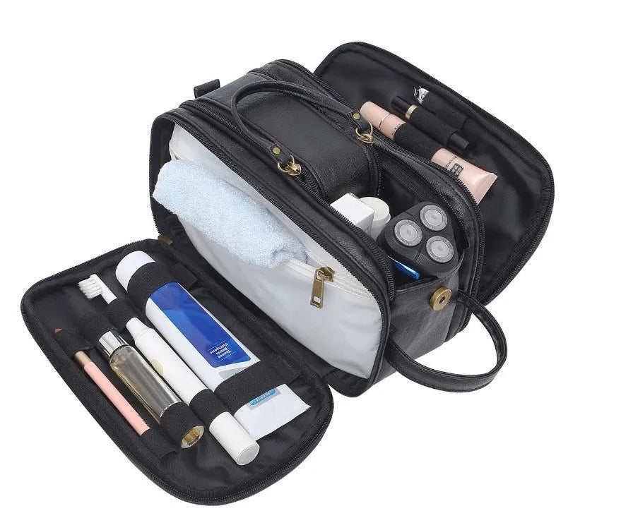 Black and brown men's Pu leather toiletry bag with zipped compartments open.