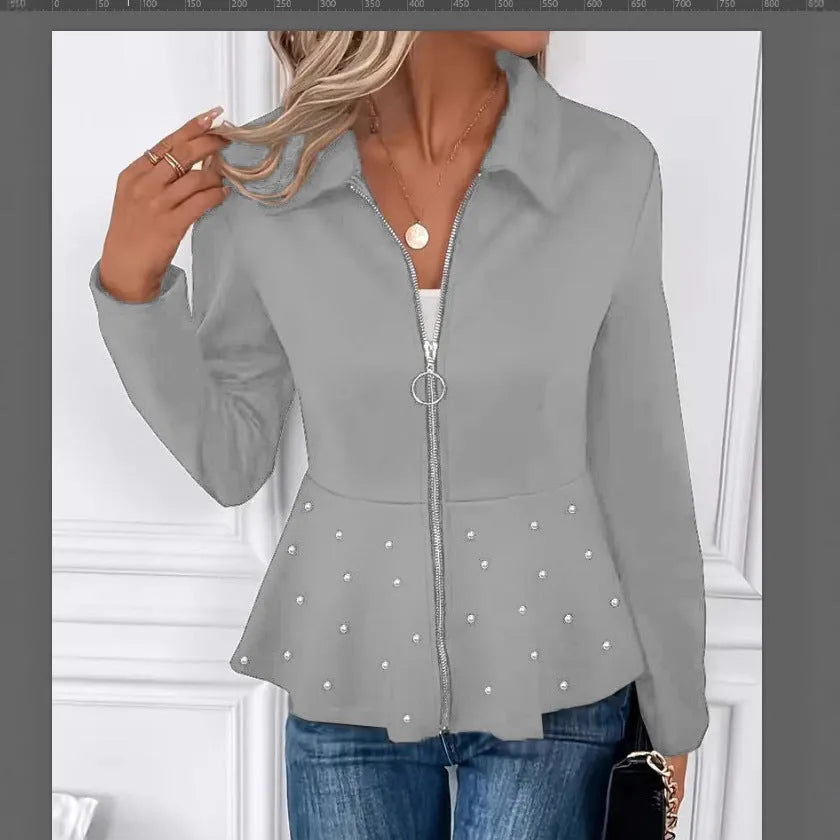 Women's black loose fit coat with a ruffled hem and a heavy-duty front zipper.