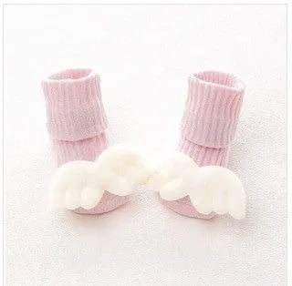 Cotton baby floor socks in various colours and patterns including bows, stars, and animal designs
