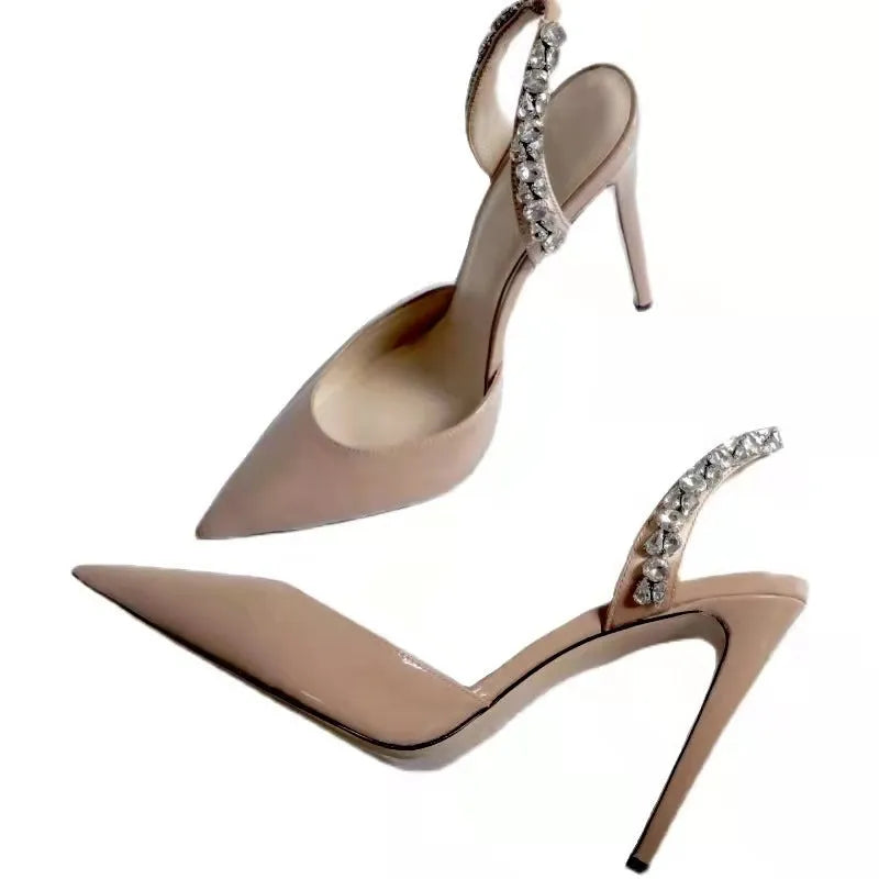 Women's black patent leather pointed toe high heel sandals with rhinestone side detail, shown on a white background.