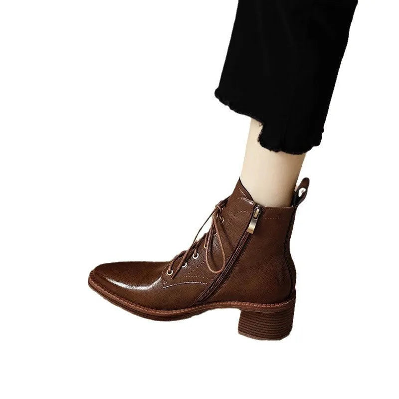 Black pointed-toe women's short tube ankle boots with a 5.5cm heel on a white background.