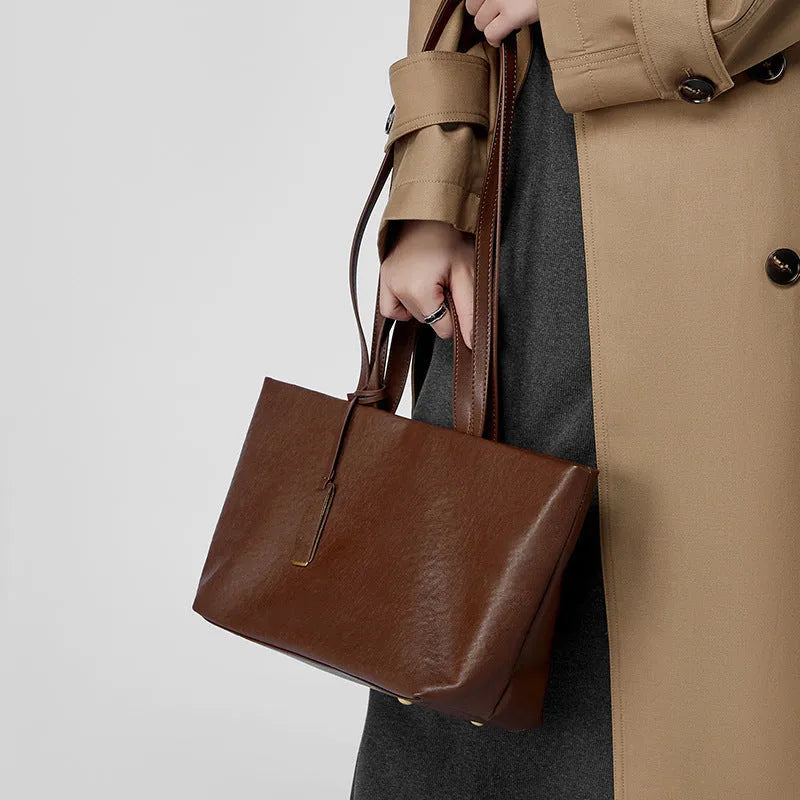 Genuine leather women's underarm shoulder bag in brown, 32x13x22cm, with sewing line detail