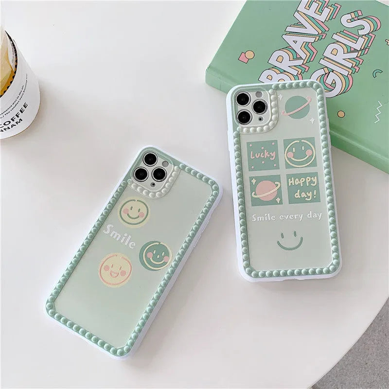 Green iPhone case with geometric pattern and smiley face polka dot design on a soft TPU back cover.