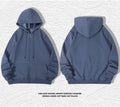 Plus size man wearing a beige heavyweight zipper hooded sweater with top-stitched pockets.