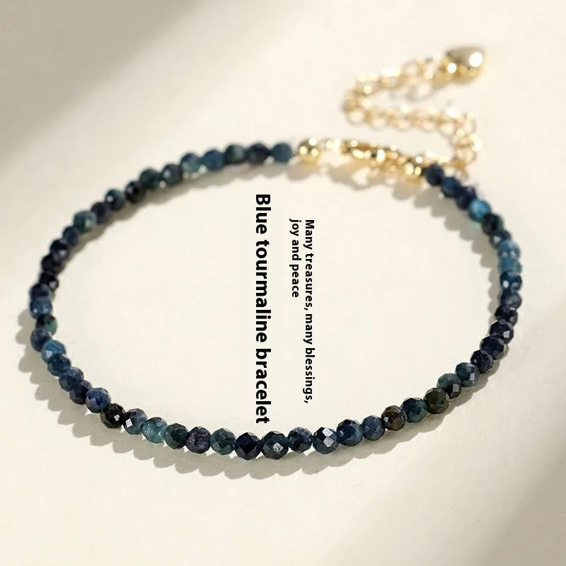 Blue tourmaline bracelet with 3mm cut beads and spacer bead design for women
