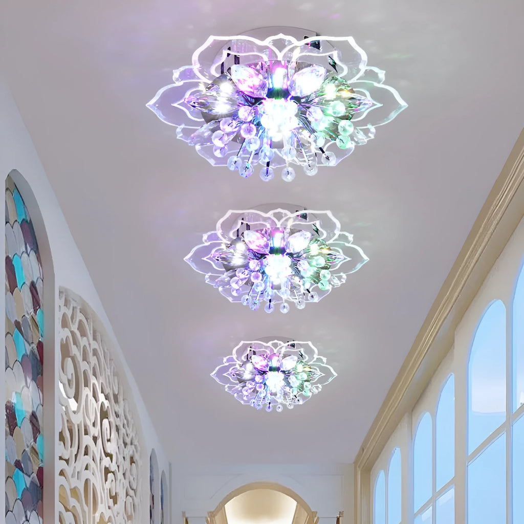 Small modern crystal and acrylic ceiling lamp with stainless steel fitting on a white ceiling.