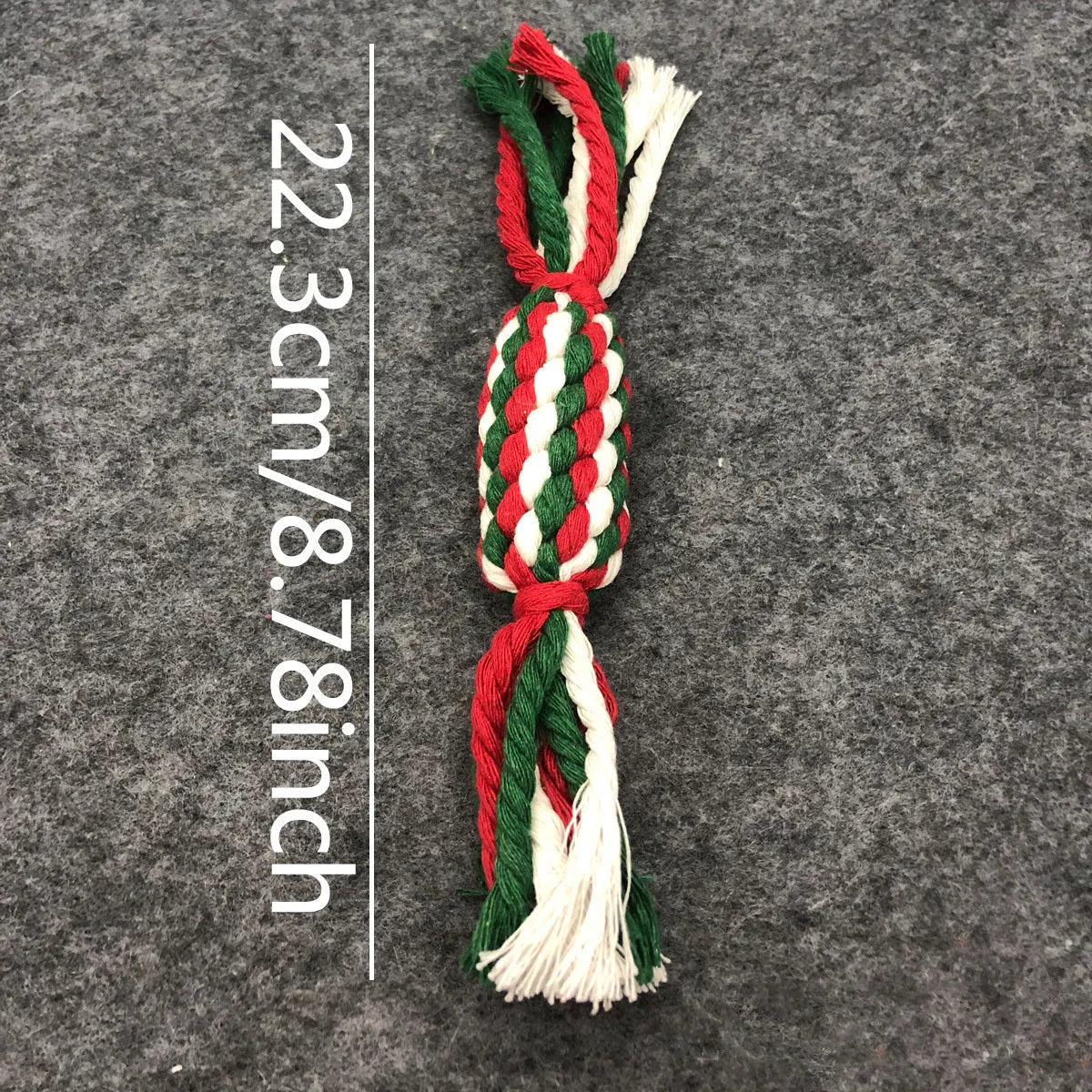 Four Christmas-themed cotton rope dog toys in red and green, including candy cane, bone, crutch, and tree shapes