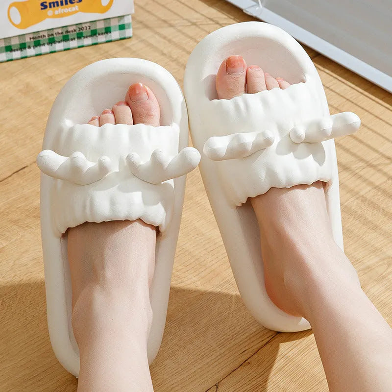 Women's deer horn pattern flip-flop slippers in light yellow with a textured EVA sole.