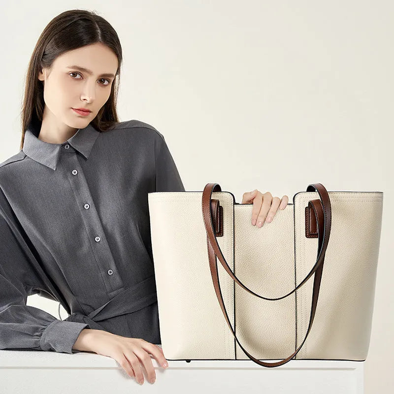Women's black genuine leather commuter bag with multiple internal compartments in horizontal square shape