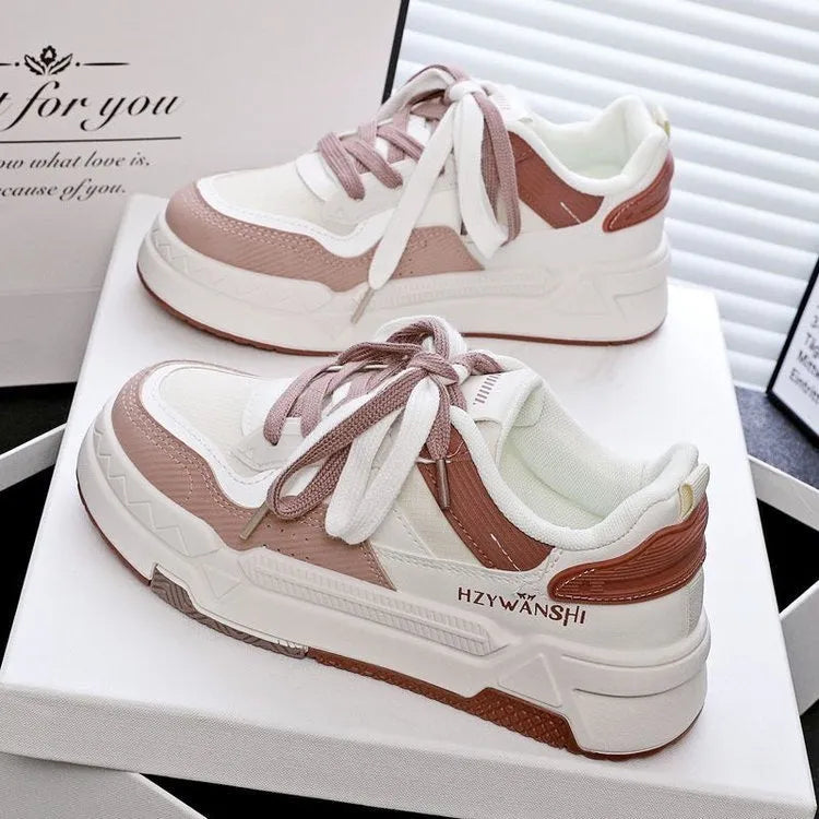 Children's beige board shoes with thick rubber soles, front lace-up closure, and cross shoulder straps.