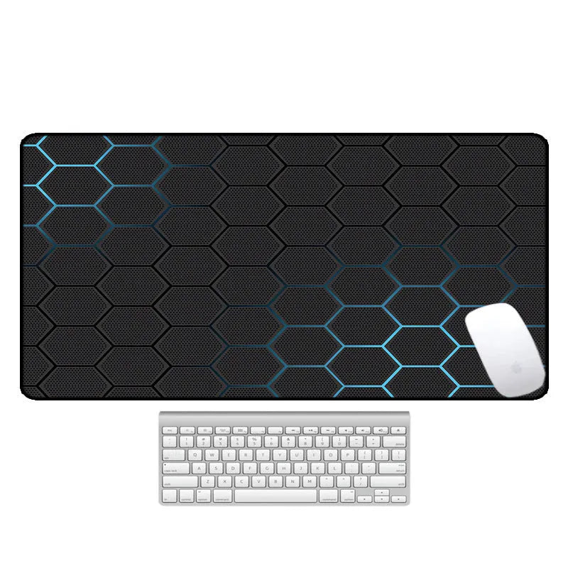 Large patterned desk mat for mouse and keyboard on a wooden desk.