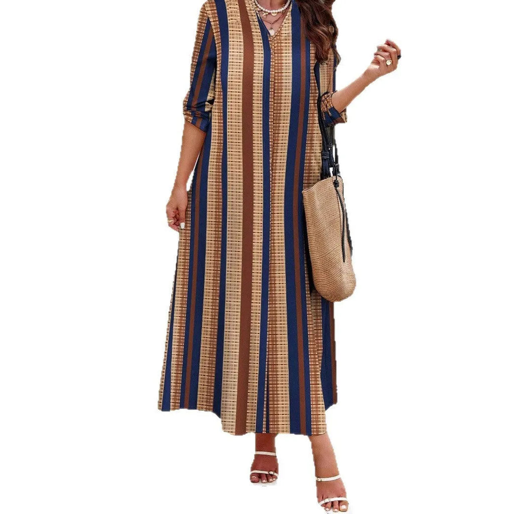 Camel coloured women's knitted dress with vertical stripes, V-neck, long sleeves, and A-line skirt.