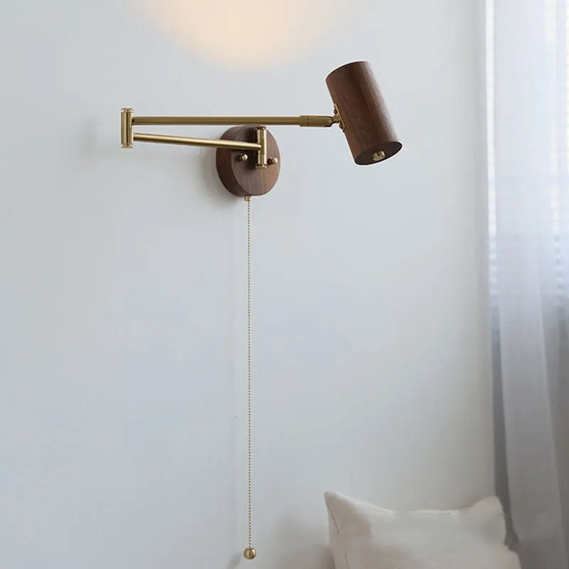 Retro wooden wall lamp with rotating spot light head and long arm, showing cord with built-in switch.