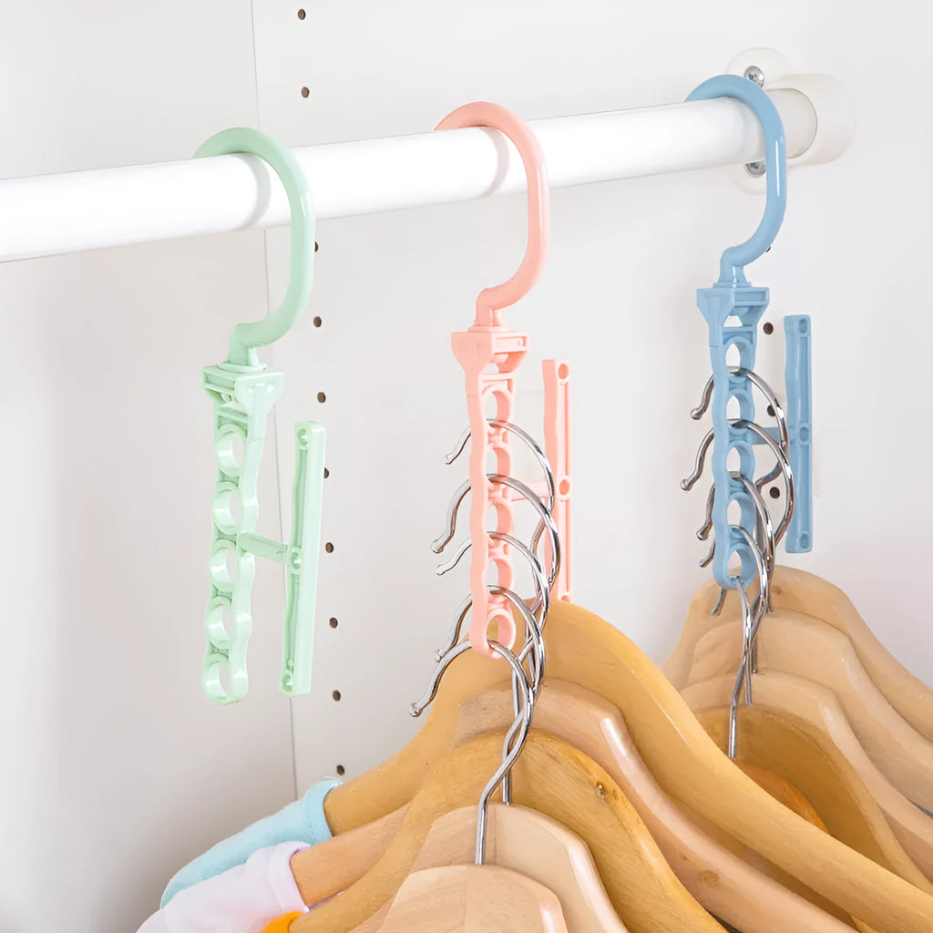 Blue plastic revolving wardrobe hanger with five rotating branches and a central handle.