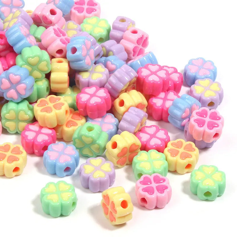 15mm acrylic four-leaf clove beads in light colours including rose red, pink, yellow, green, blue, and purple with frosted finish